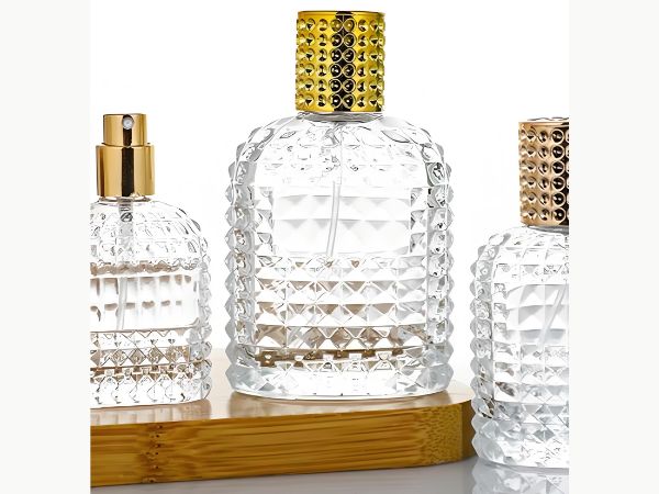 Luxury custom perfume bottles with crystal glass design, gold caps, and premium fragrance packaging